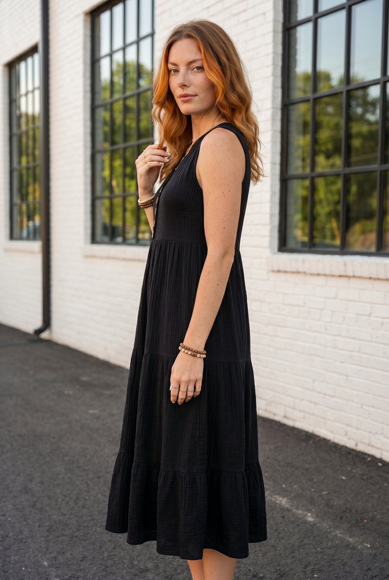 Schwarzes Midikleid mit V-Ausschnitt und Stufenrock – Foto 4